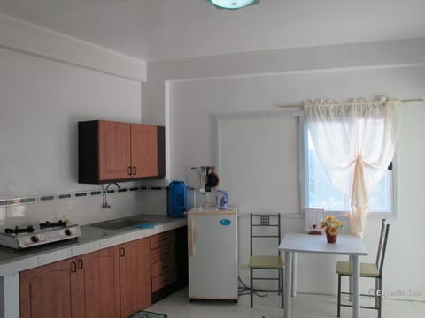 Suite, 1 Bedroom | Private kitchen | Full-size fridge, stovetop, electric kettle, cookware/dishes/utensils