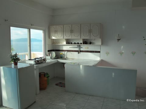 Suite, 2 Bedrooms | Private kitchenette | Full-size fridge, stovetop, electric kettle, cookware/dishes/utensils