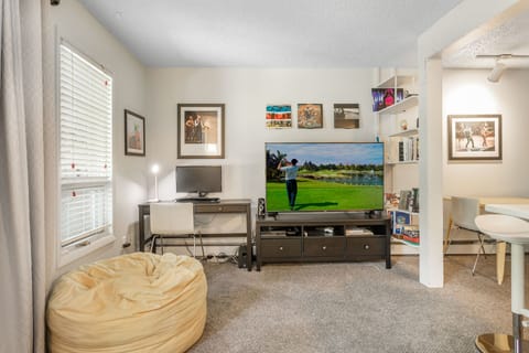 60 inch 4K TV, Desk with keyboard & monitor