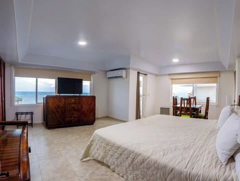 Standard Quadruple Room, Partial Ocean View | Minibar, in-room safe, desk, soundproofing