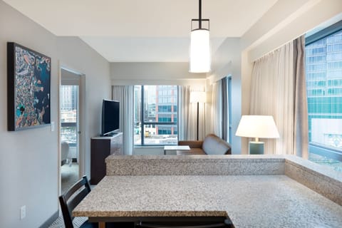 Suite, 1 Bedroom | Living room | 32-inch Smart TV with cable channels, TV, Netflix
