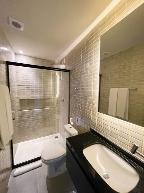 Luxury Room, Beach View | Bathroom | Shower, towels