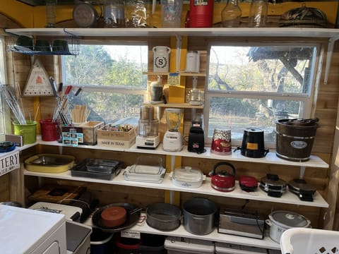 Utility (laundry) room with extra kitchen appliances, pots, pans, etc.
