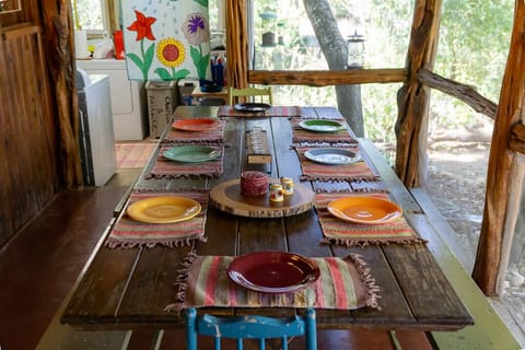 Dining table on back screen porch can seat as many as 10 people.  