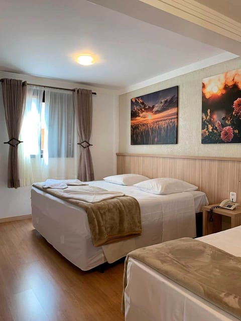 Deluxe Triple Room | Minibar, blackout drapes, iron/ironing board, free WiFi