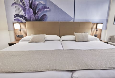 Deluxe Room, Multiple Beds | In-room safe, desk, soundproofing, iron/ironing board