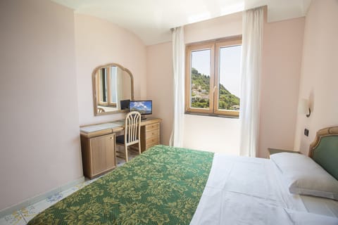 Standard Double Room, Sea View | Minibar, in-room safe, desk, blackout drapes