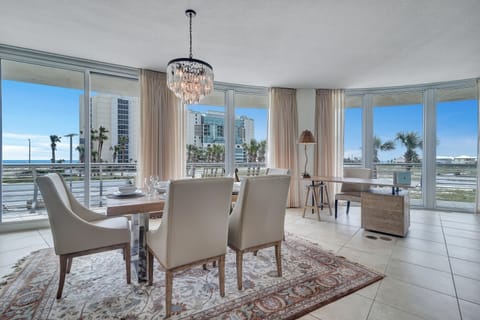 Imagine yourself in this high-end luxury condo, where the open layout flows effortlessly from the well-equipped kitchen to the spacious living and dining areas, all while being just a stroll away from Flora-Bama.