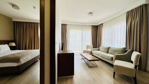 Deluxe Suite, 1 Bedroom, Non Smoking, Sea View | Living area | 55-inch LCD TV with satellite channels