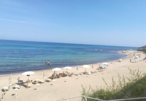 Private beach, white sand, sun loungers, beach umbrellas