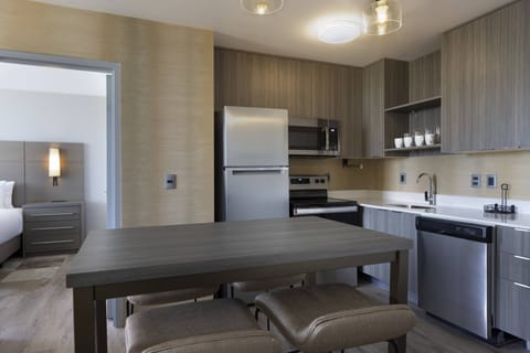 Suite, 2 Bedrooms, Balcony | Private kitchen | Full-size fridge, microwave, stovetop, dishwasher