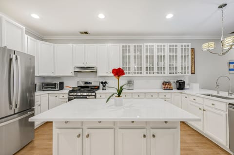Check out the large kitchen! Stocked with utensils, dishware, and a KCup machine