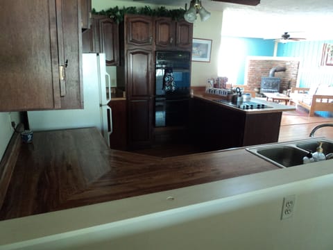 Kitchen - 2 ovens, fridge, stove top, dishwasher.