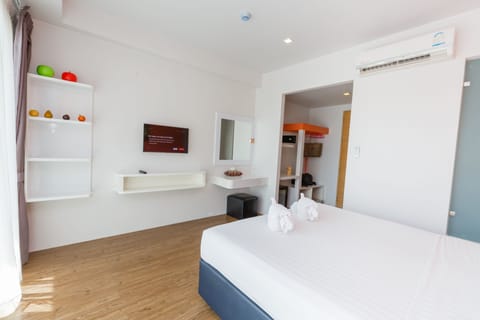 Deluxe Room, Pool View | Minibar, in-room safe, desk, free WiFi