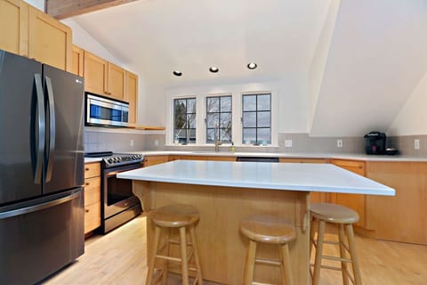 main house- kitchen with new stainless steel appliances and quartz countertops