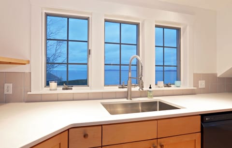 main house- a view of the water out of the kitchen windows