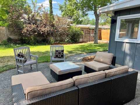 Outdoor seating, fenced yard, shade trees