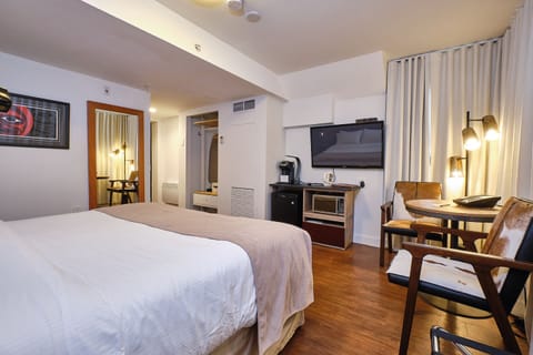 Deluxe Room, 1 King Bed | Premium bedding, down comforters, in-room safe, individually decorated