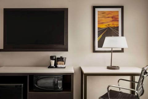 Desk, laptop workspace, blackout drapes, iron/ironing board