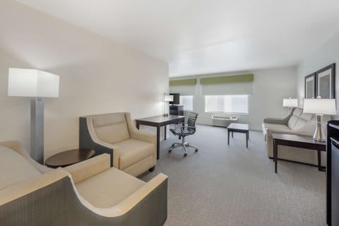 Premium bedding, desk, laptop workspace, blackout drapes