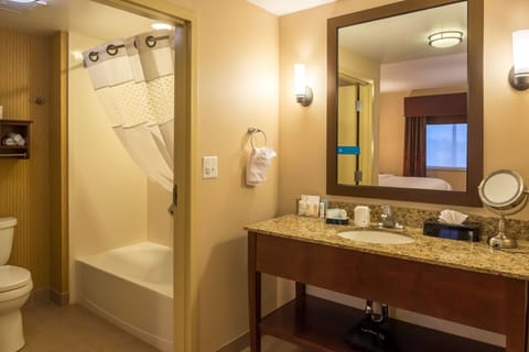 Suite, One King Bed | Bathroom | Combined shower/tub, free toiletries, towels