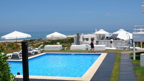 Seasonal outdoor pool, pool umbrellas, sun loungers