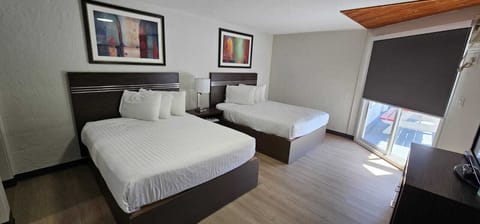 Standard Room, 2 Queen Beds, Kitchenette | Living area | Flat-screen TV