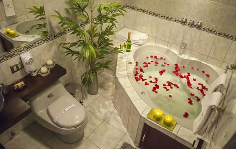 Suite, Jetted Tub | Bathroom | Free toiletries, hair dryer, towels