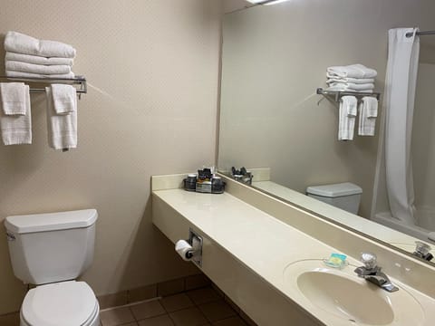 Deluxe Room, 2 Queen Beds, Non Smoking | Bathroom | Combined shower/tub, hair dryer, towels
