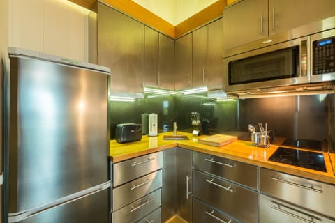 Suite, 1 Bedroom | Private kitchen | Full-size fridge, microwave, stovetop, coffee/tea maker