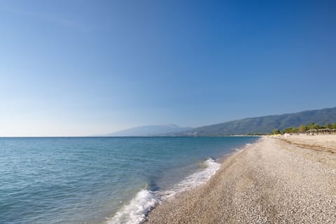 Private beach, white sand, sun loungers, beach umbrellas