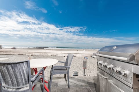 The front balcony includes 2 bistro table, seating, and a propane gas BBQ grill for evening cookouts with unbeatable views!
