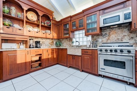 The kitchen comes stocked with a basic supply of dishes, utensils, cookware, bakeware, and all large and small appliances. Guests must supply their own food, drinks (including coffee), spices, condiments, and paper goods