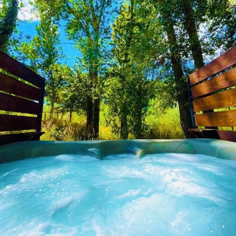 Hot tub nestled in the trees.
