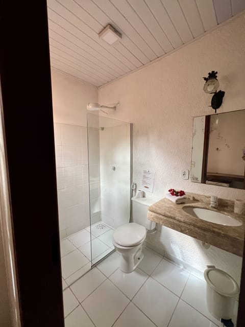 Economy Triple Room | Bathroom | Shower, towels