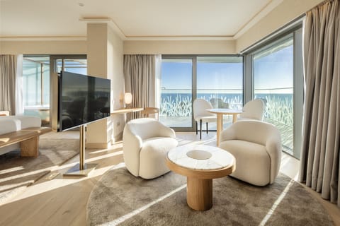 Suite, Ocean View | Living area | TV