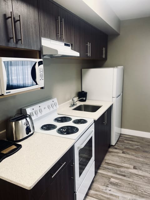 Suite, Multiple Beds, Non Smoking (Efficiency, Upgrade) | Private kitchenette | Fridge, microwave