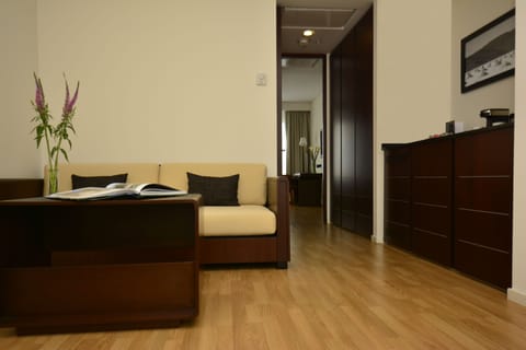 Suite, 1 King Bed, Non Smoking | Living area | 39-inch LCD TV with satellite channels, TV