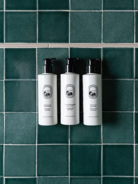 Designer toiletries, hair dryer, bathrobes, towels