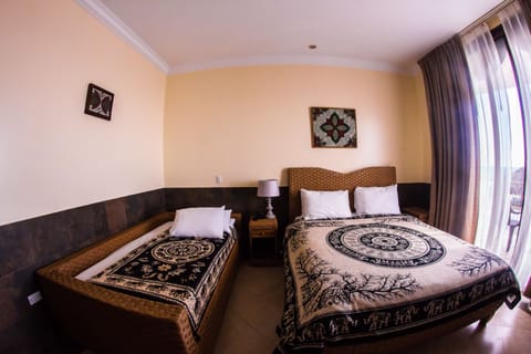 Double Room | Down comforters, in-room safe, individually decorated, desk