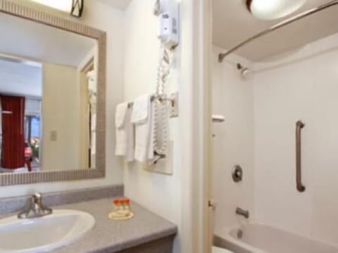 Bathtub, eco-friendly toiletries, towels