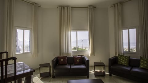 Luxury Suite, Beach View | Living room | TV