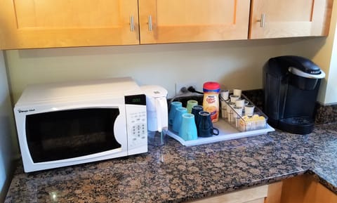 Well stocked kitchen with microwave, Keurig coffee maker, water filter, etc