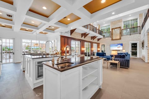 The Chef's open kitchen offering canal views features three islands and a butler's pantry and a breakfast nook.