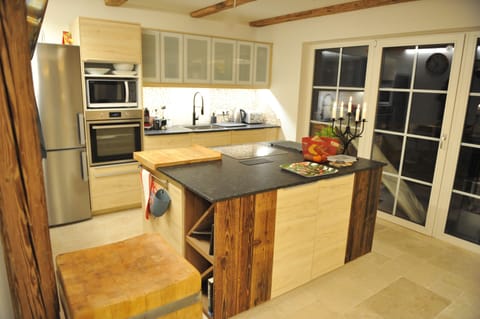 A modern full kitchen with lots of antique touches