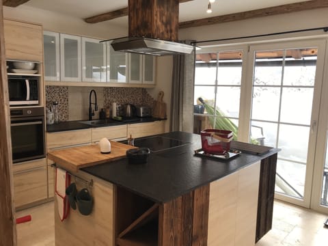 Kitchen, looking out onto snow-covered terrace