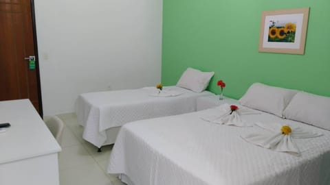 Family Triple Room, Multiple Beds | Minibar, in-room safe, free WiFi, bed sheets