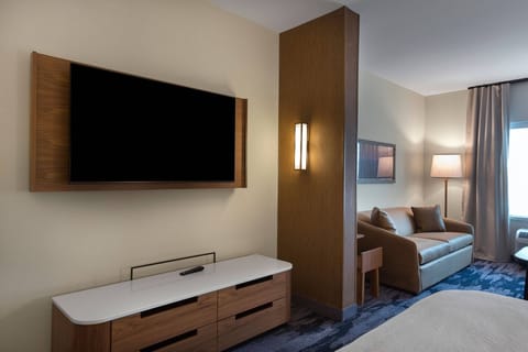 Suite, 1 King Bed with Sofa bed | Living area | 60-inch Smart TV with cable channels, TV, Netflix