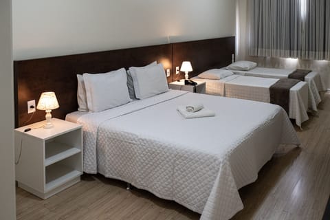 Standard Quadruple Room | Desk, blackout drapes, free WiFi, bed sheets