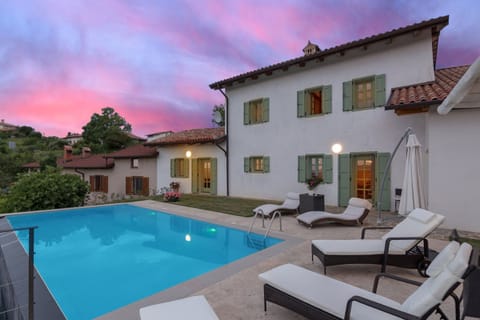 Pool and the back yard in sunset